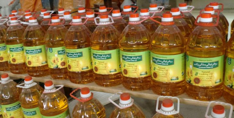 Sanaizada Edible Oil Production Company, a grant recipient, contracted 26 female farmers and periodically hired female workers to clean, prepare, and label its bottles. Photo credit: Landell Mills Ltd.