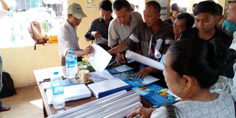 Local language materials distributed to communities in Myanmar during consultations along the East-West economic corridor. Photo credit: Paul Donowitz.
