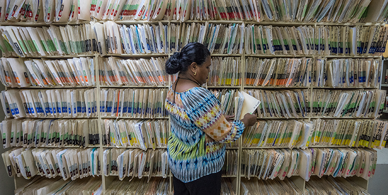 Artificial intelligence and machine learning can make sorting through voluminous documents easier and faster by automatically identifying and classifying records. Photo credit: ADB.