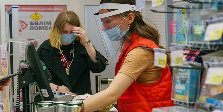 Use of medical masks and avoiding direct physical contact with other persons can prevent COVID-19 transmission in the workplace. Photo credit: ADB.