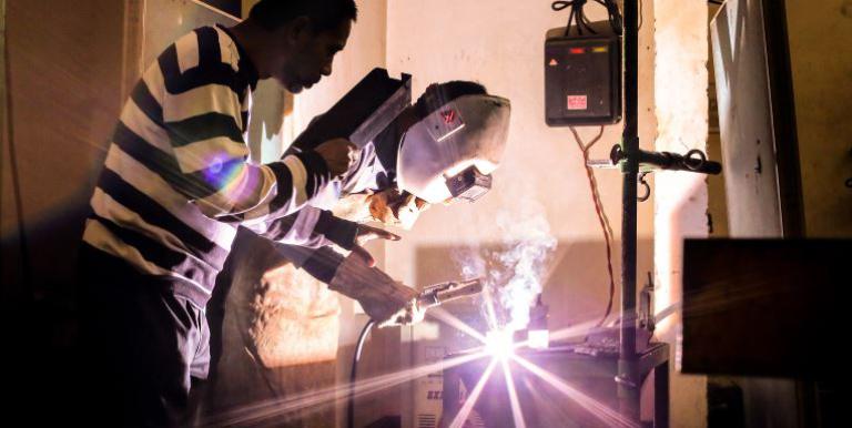 An instructor guiding a trainee welder attending a short training under the Skills Development Project in Bangladesh. The Project aims to help reduce unemployment rates in Bangladesh. Photo credit: ADB.