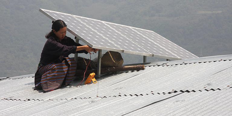 A solar panel is installed on a roof in Bhutan. The South Asian country is the first to become carbon negative in the world. Photo credit: Asian Development Bank. 