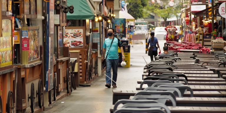 Shops and restaurants are open for business, but customers are few and far between in this once-bustling district in Singapore. Photo credit: ADB.